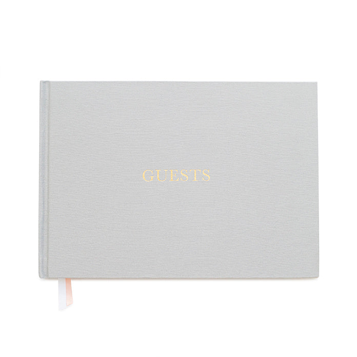 Grey color fabric bookcloth covered guest book with the word guest in gold foil print