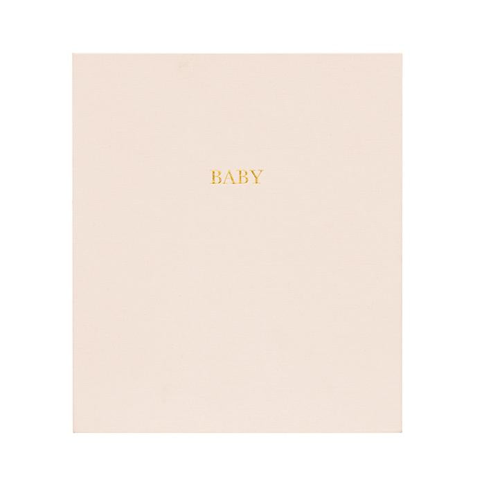Pink book with the word baby in gold foil printed on the front cover.