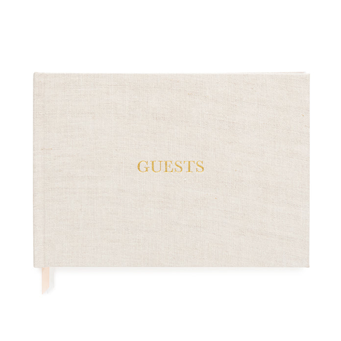 Natural color fabric bookcloth covered guest book with the word guest in gold foil print